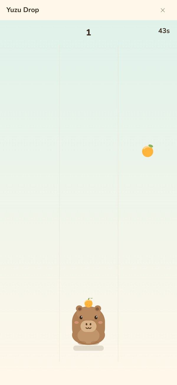 Yuzu Drop: the capybara waiting at the bottom of three lanes as a yuzu falls